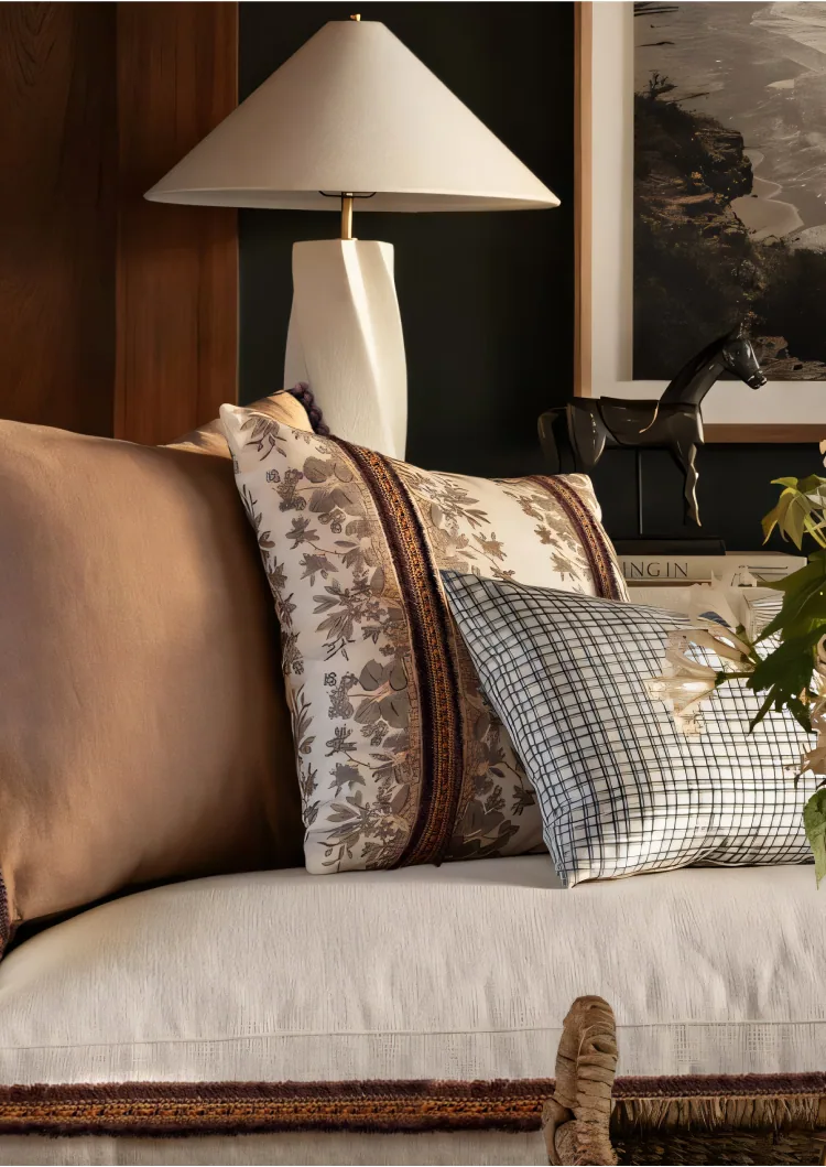 Sofa styled with Zanzibar Collection braided and fringed cushions